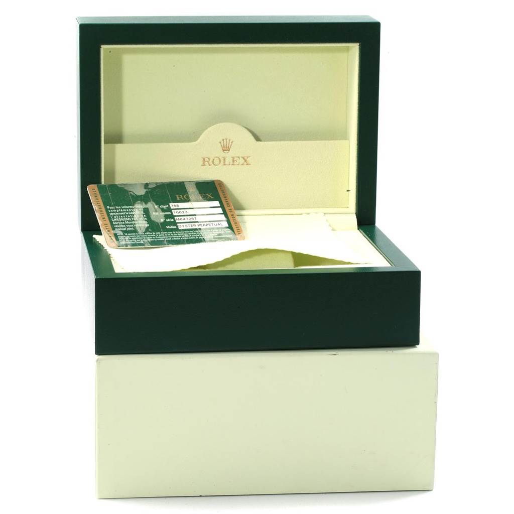 The image shows an open Rolex Yacht-Master 16623 Men's Stainless Steel Blue Dial 16623 Men's Stainless Steel Blue Dial watch box with a certificate card and a cleaning cloth inside.