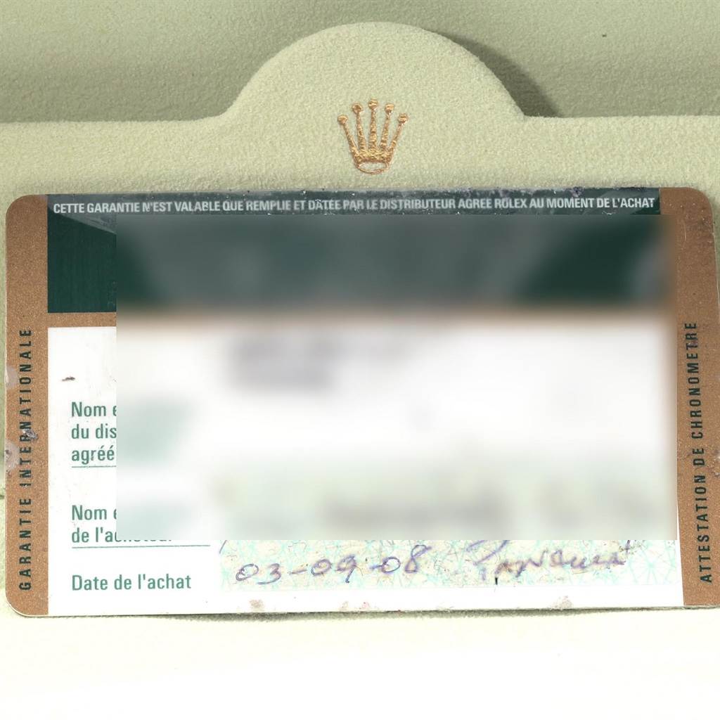 This image shows a close-up of the guarantee card for the Rolex Yacht-Master 16623 Men's Stainless Steel Blue Dial 16623 Men's Stainless Steel Blue Dial model, including the purchase date and dealer details.