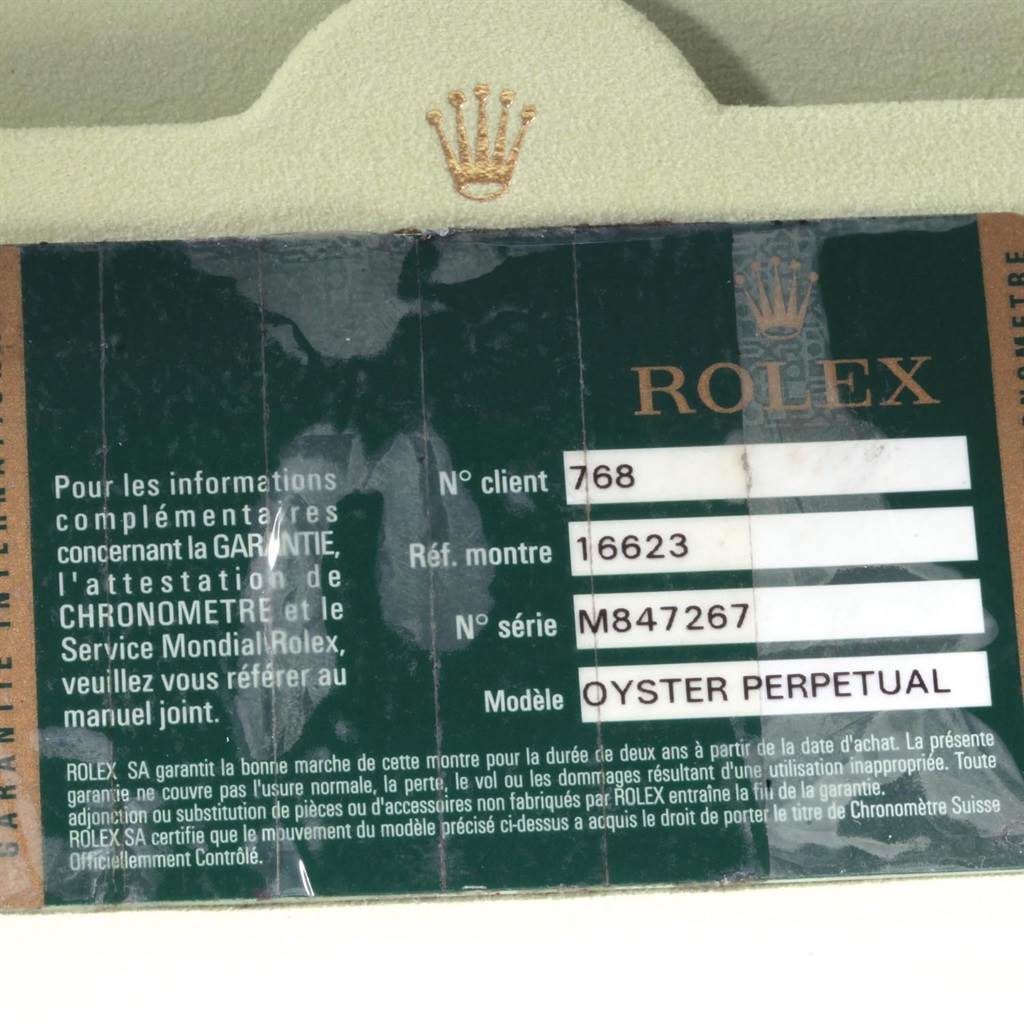 The image shows a Rolex Yacht-Master 16623 Men's Stainless Steel Blue Dial 16623 Men's Stainless Steel Blue Dial model warranty card with details including model and serial numbers.