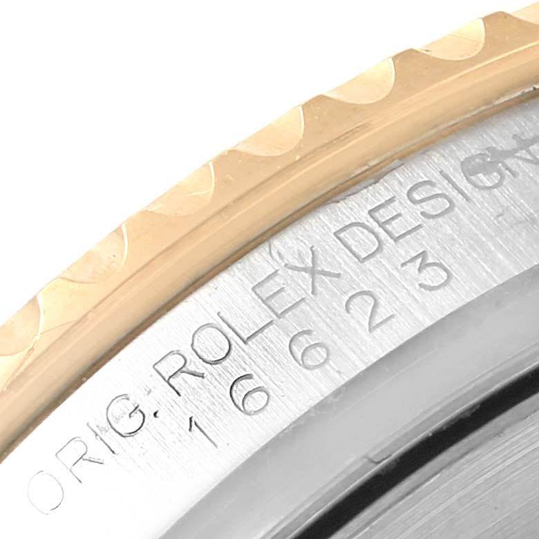 Close-up of the Yacht-Master model by Rolex, showing part of the bezel and engraved details on the case.