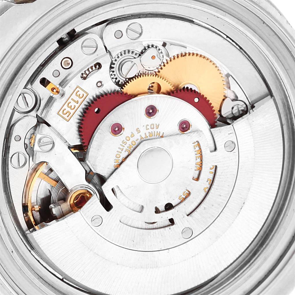 The image shows a close-up view of the movement inside a Rolex Yacht-Master 16623 Men's Stainless Steel Blue Dial 16623 Men's Stainless Steel Blue Dial watch, highlighting gears and mechanical components.