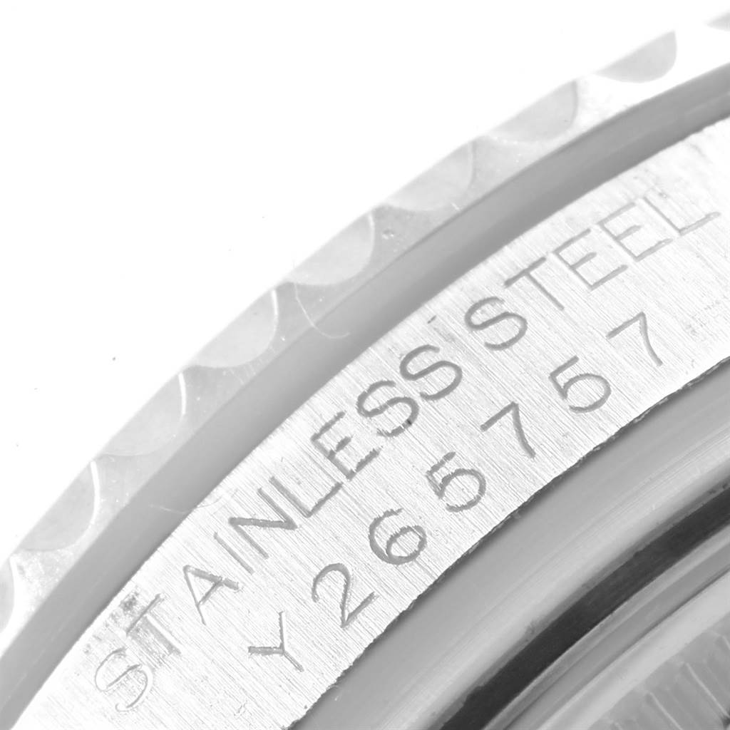 The image shows a close-up of the edge of a Rolex Yacht-Master 168622 Men's Stainless Steel Silver Dial 168622 Men's Stainless Steel Silver Dial watch, highlighting the stainless steel inscription and part of the bezel.