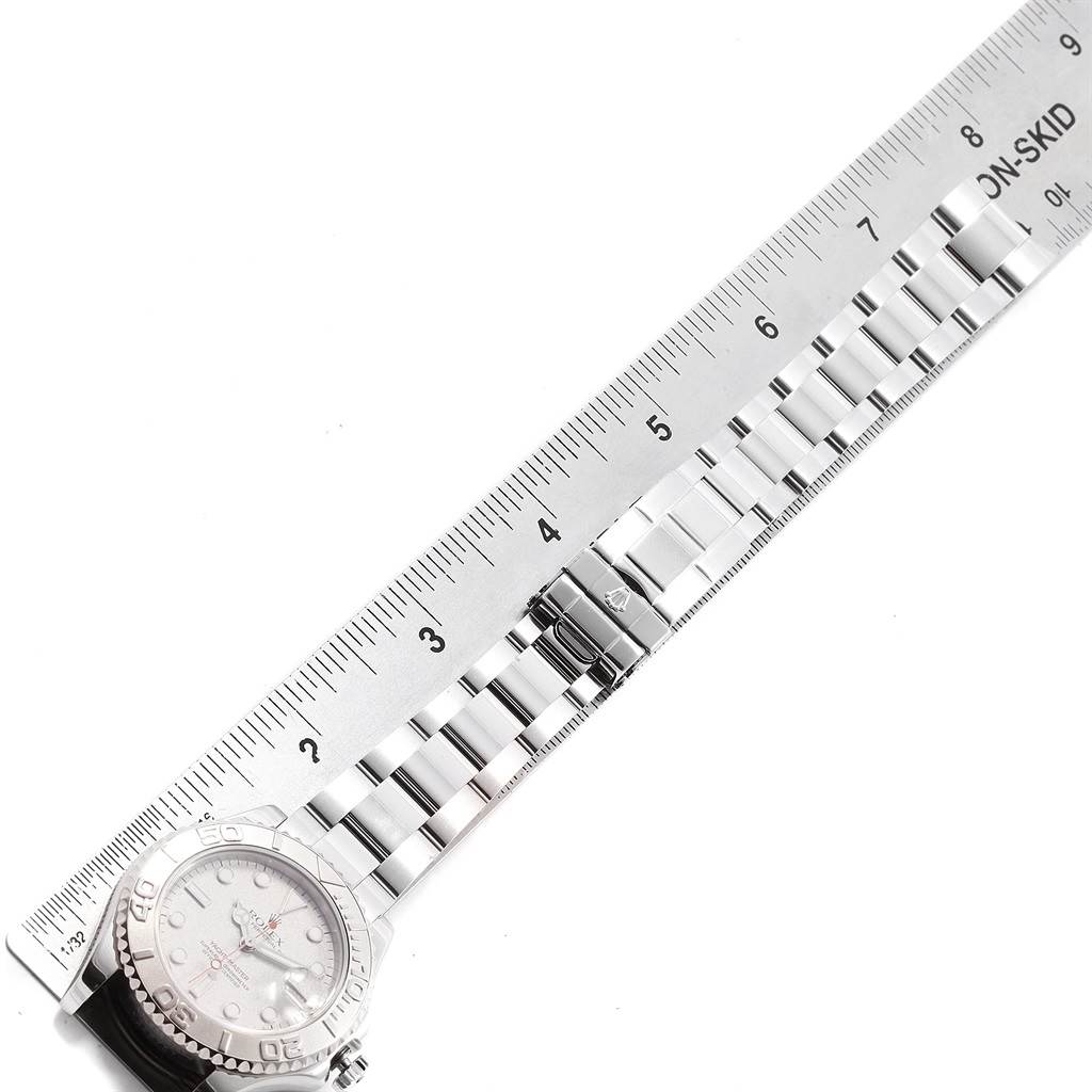 The image shows a Rolex Yacht-Master 168622 Men's Stainless Steel Silver Dial 168622 Men's Stainless Steel Silver Dial watch at a top-down angle, displaying the face and bracelet alongside a measuring ruler.