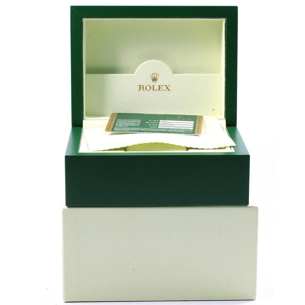This image shows an open Rolex Yacht-Master 16623 Men's Stainless Steel White Dial 16623 Men's Stainless Steel White Dial watch box with a warranty card and cloth inside.