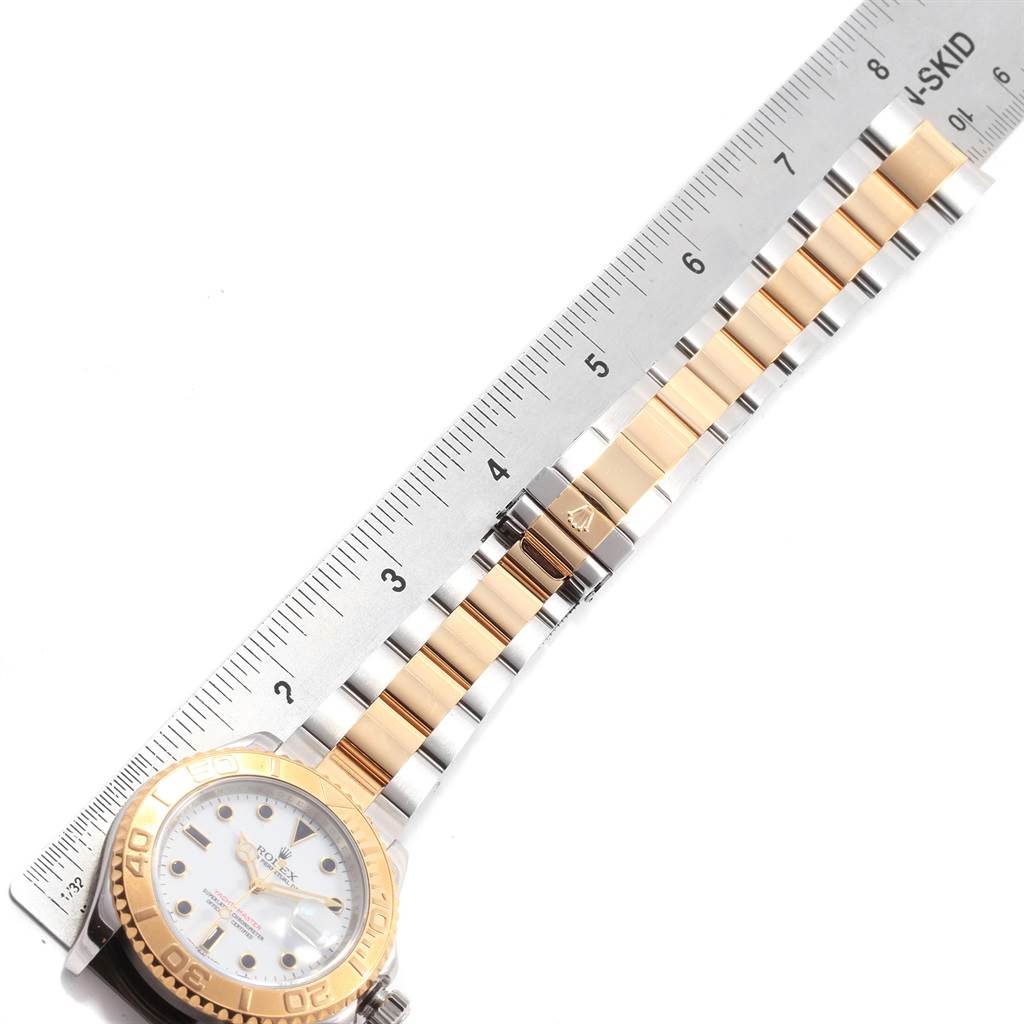 This image shows the face and bracelet of the Rolex Yacht-Master 16623 Men's Stainless Steel White Dial 16623 Men's Stainless Steel White Dial watch, measured against a ruler.