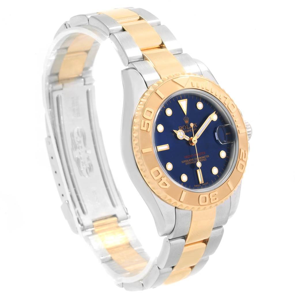 The Rolex Yacht-Master 168623 Men's Steel and Gold (two tone) Blue Dial 168623 Men's Steel and Gold (two tone) Blue Dial watch is shown at an angled view, displaying the face, bezel, and two-toned metal bracelet.