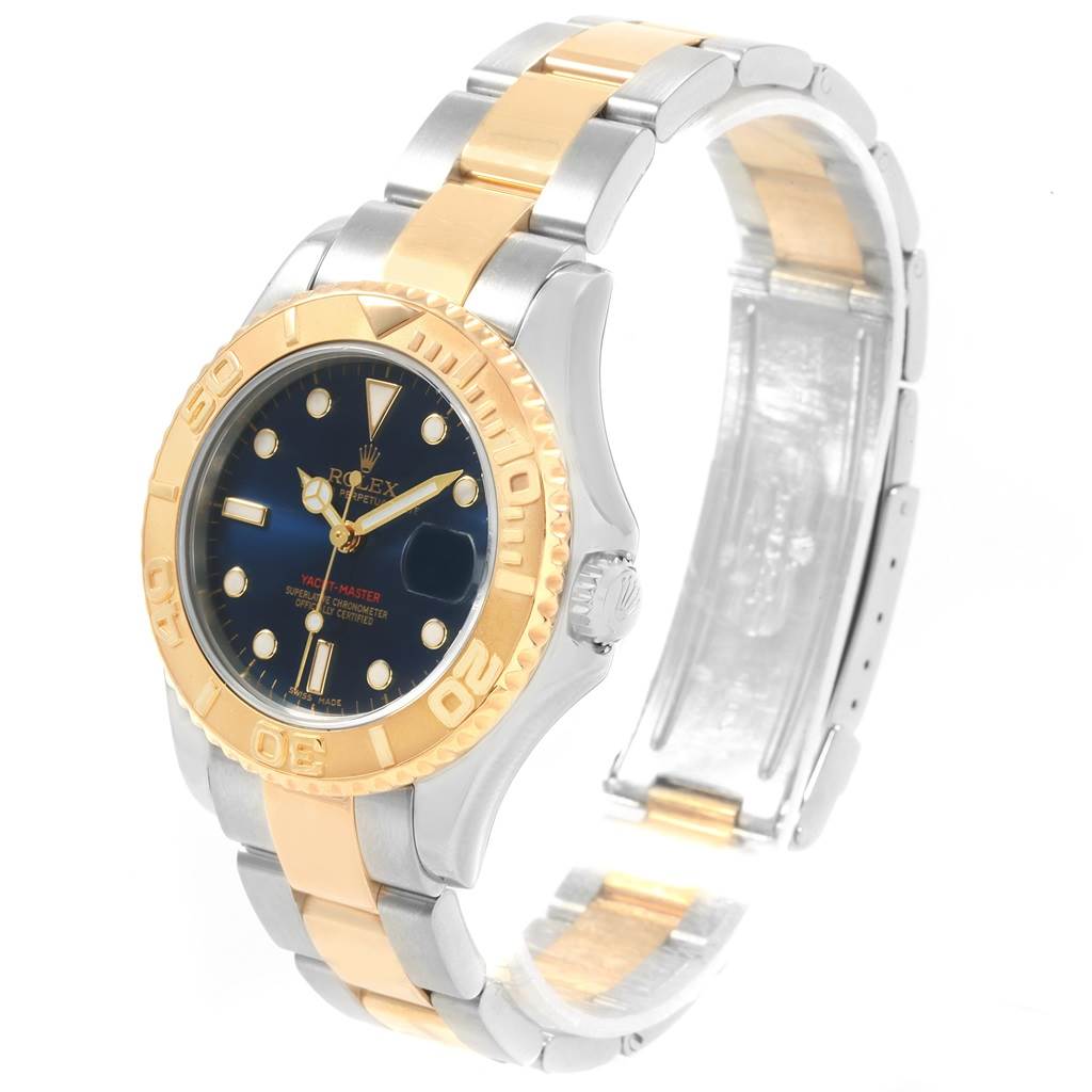 The image shows a Rolex Yacht-Master 168623 Men's Steel and Gold (two tone) Blue Dial 168623 Men's Steel and Gold (two tone) Blue Dial watch from an angled side view, highlighting its two-tone metal bracelet and bezel.