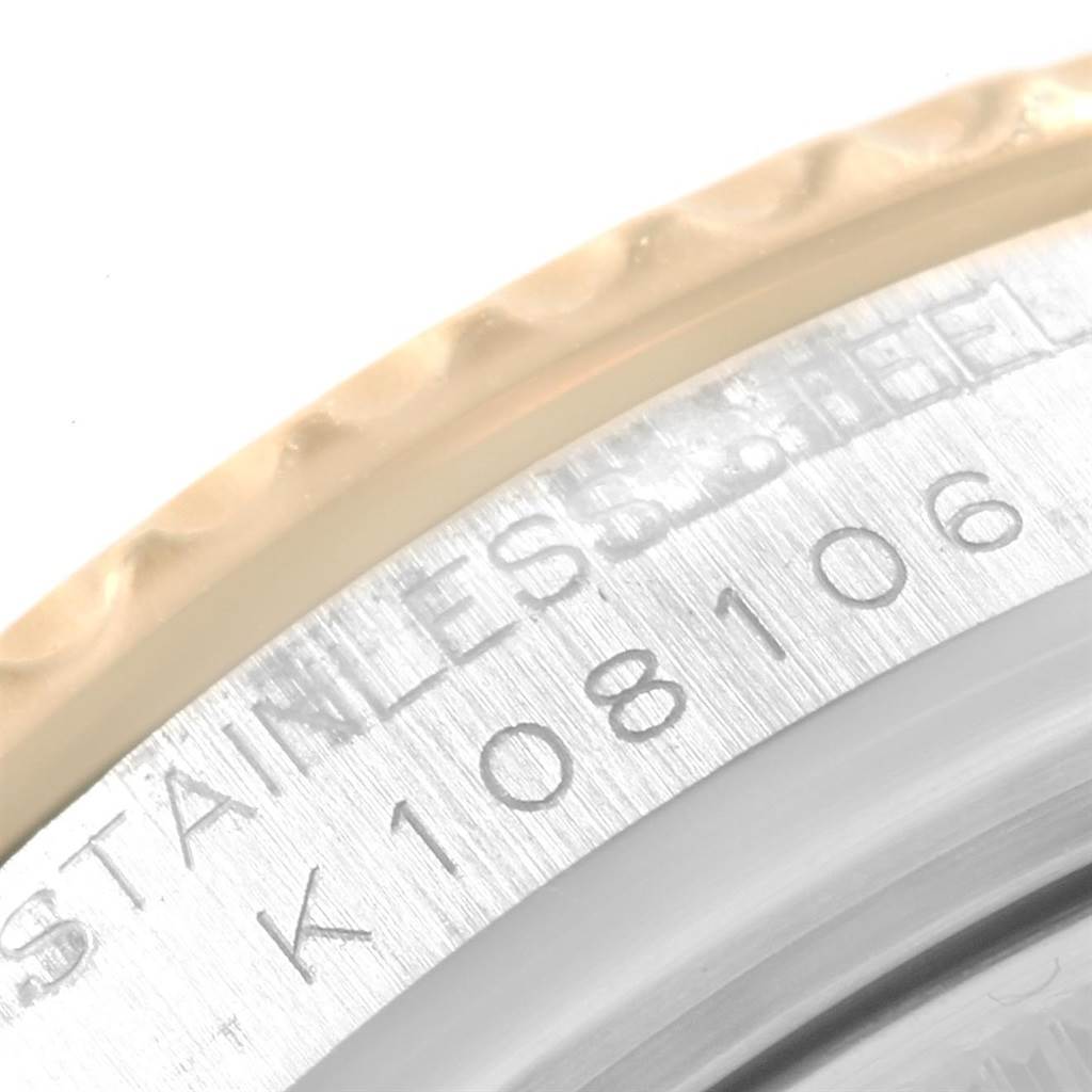 This close-up image shows the engraved stainless steel and bezel of a Rolex Yacht-Master 168623 Men's Steel and Gold (two tone) Blue Dial 168623 Men's Steel and Gold (two tone) Blue Dial watch.