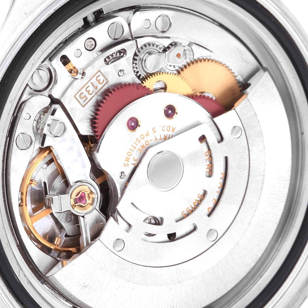 This close-up image shows the internal mechanism of the Rolex Yacht-Master 16623 Men's Stainless Steel White Dial 16623 Men's Stainless Steel White Dial watch, featuring gears and intricate components.