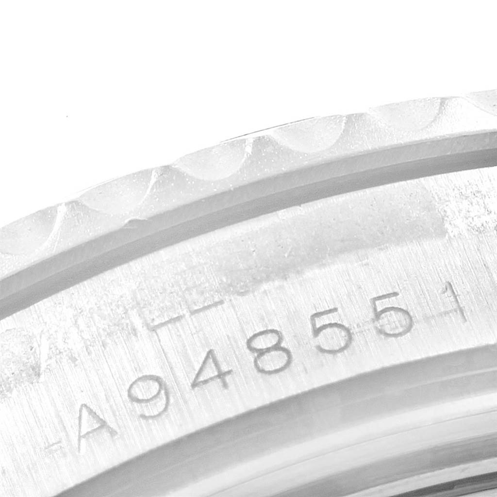 This is a close-up shot of the serial number located on the edge of the bezel of a Rolex Yacht-Master 168622 Men's Stainless Steel Silver Dial 168622 Men's Stainless Steel Silver Dial watch.