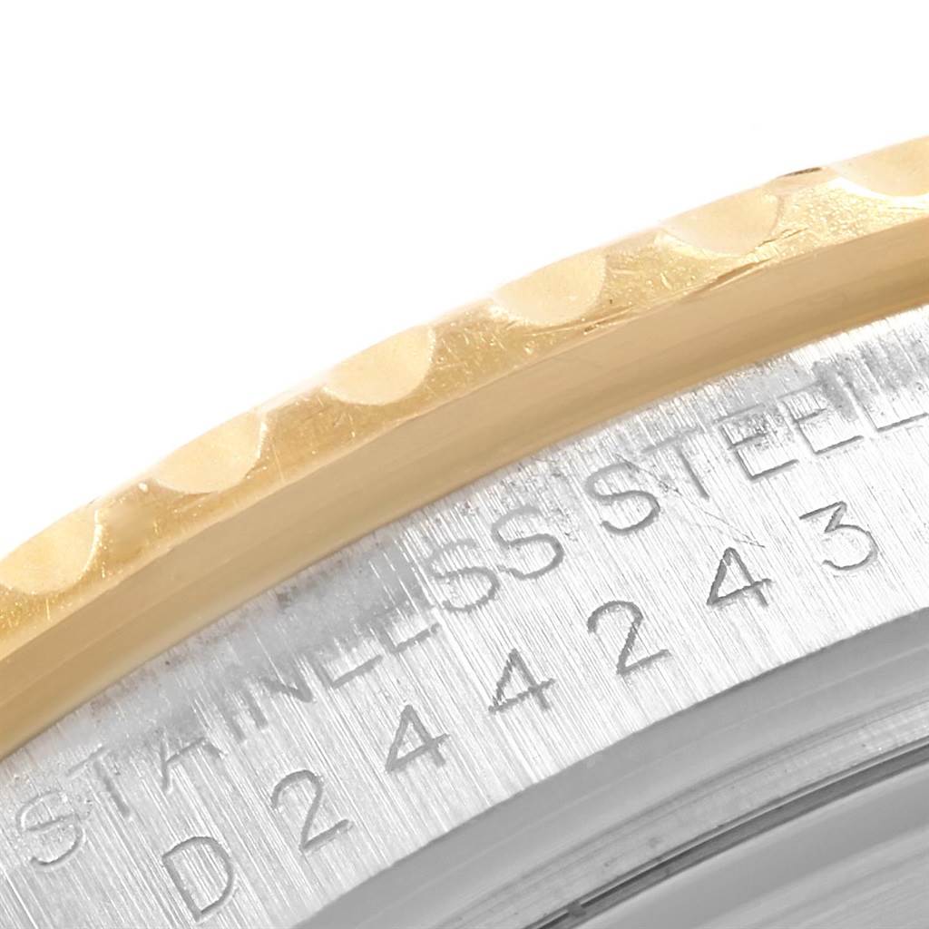 This image shows a close-up of the case back and the edge of the bezel of a Rolex Yacht-Master 16623 Men's Stainless Steel White Dial 16623 Men's Stainless Steel White Dial watch.