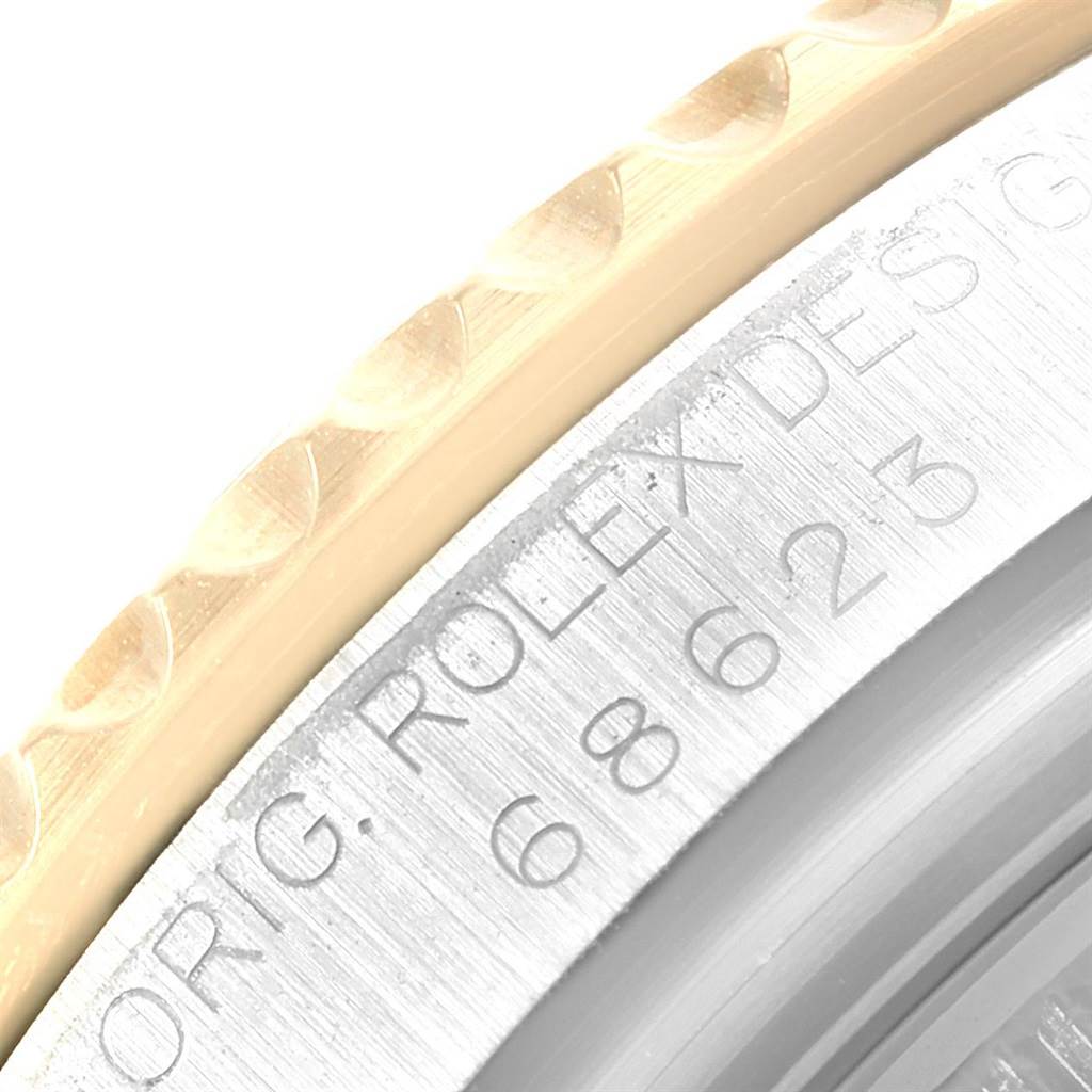 The image shows a close-up of the bezel and case side of a Rolex Yacht-Master 68623 Men's Steel and Gold (two tone) White Dial 68623 Men's Steel and Gold (two tone) White Dial watch, highlighting the engraved text on the case.