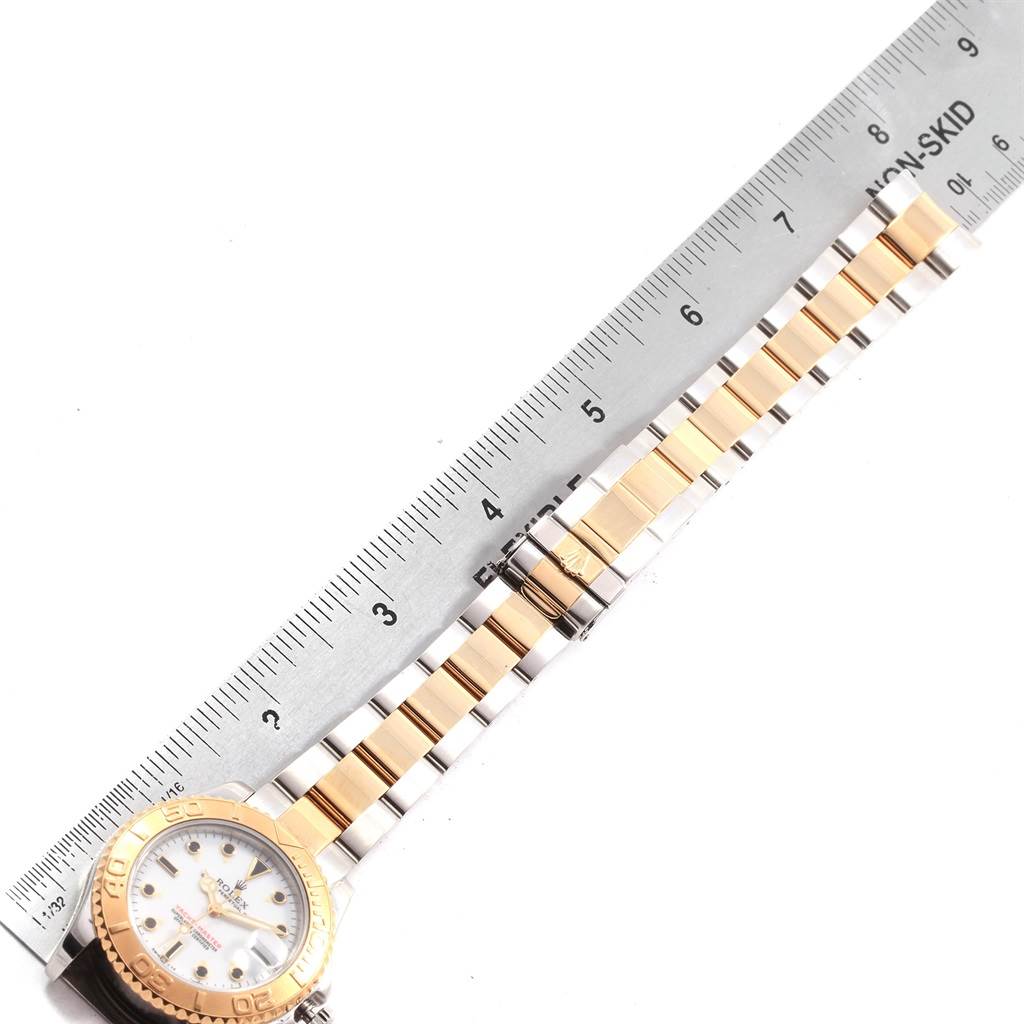 The image shows the Rolex Yacht-Master 68623 Men's Steel and Gold (two tone) White Dial 68623 Men's Steel and Gold (two tone) White Dial watch laid flat, showcasing the bracelet and part of the watch face, measured against a ruler.