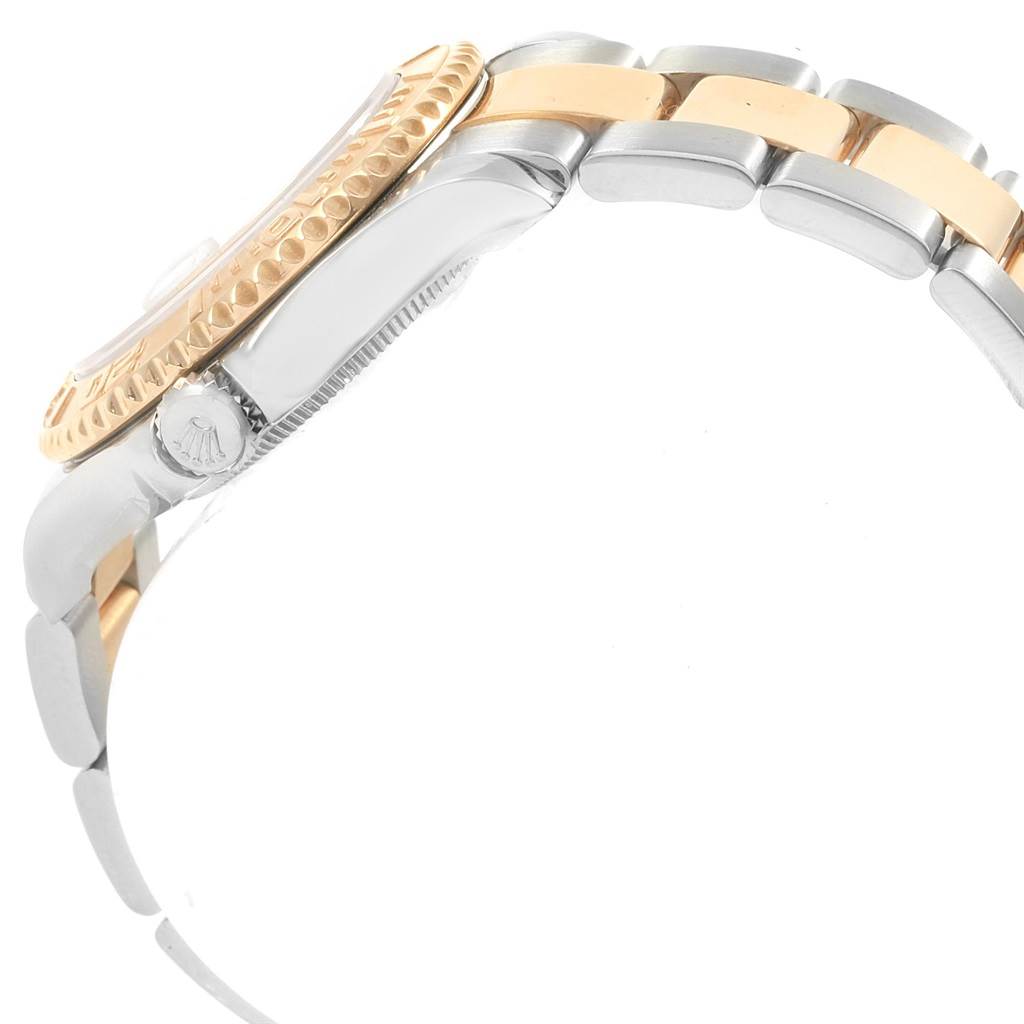 This side view shows the case, crown, and bracelet of a Rolex Yacht-Master 68623 Men's Steel and Gold (two tone) White Dial 68623 Men's Steel and Gold (two tone) White Dial watch.