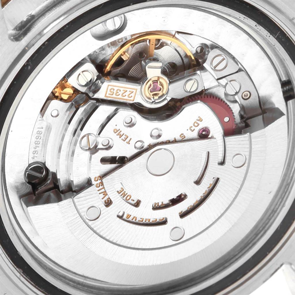 The image shows a close-up view of the internal mechanics and movement of a Rolex Yacht-Master 168623 Men's Steel and Gold (two tone) Blue Dial 168623 Men's Steel and Gold (two tone) Blue Dial watch.