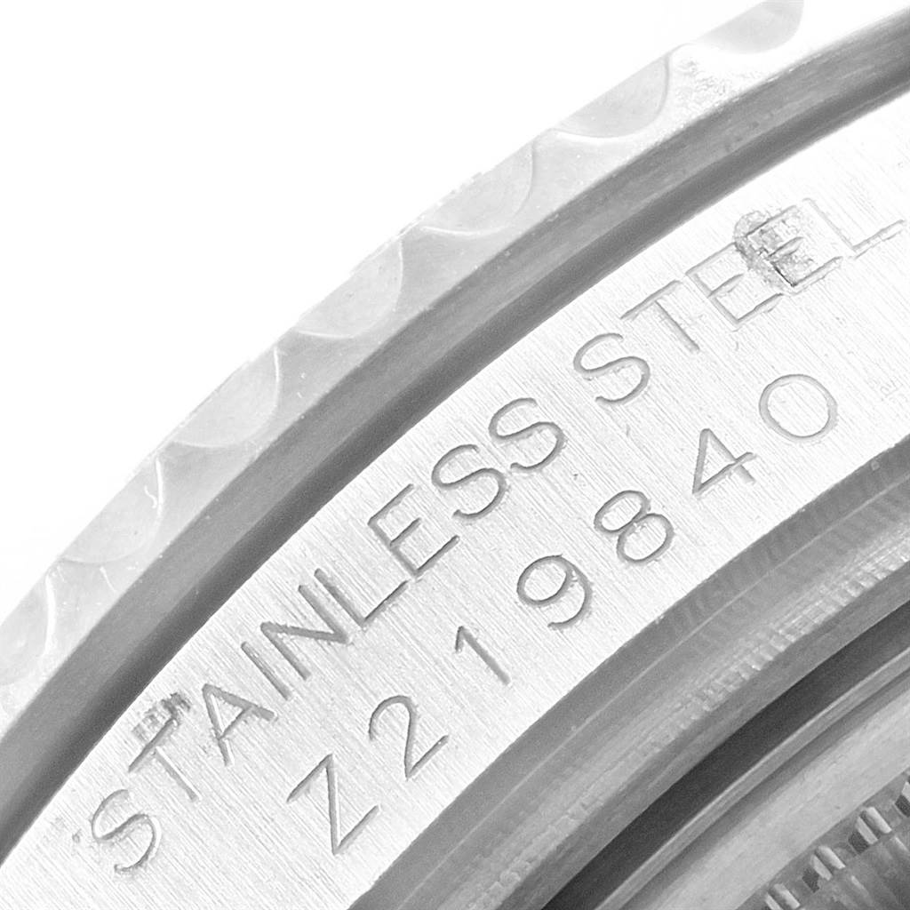 This close-up image shows the side of the stainless steel case of a Rolex Yacht-Master 168622 Men's Stainless Steel Silver Dial 168622 Men's Stainless Steel Silver Dial watch, including part of its serial number.