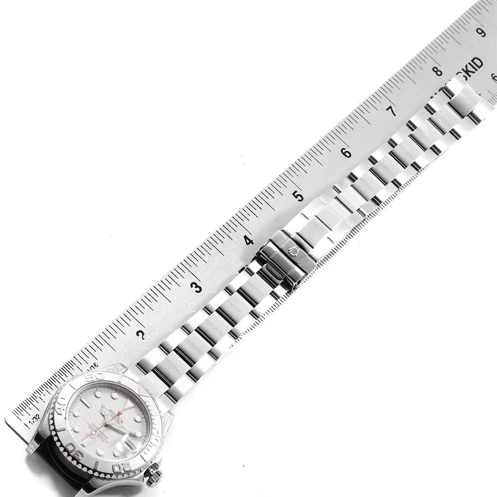 The image shows a flat-lay view of a Rolex Yacht-Master 168622 Men's Stainless Steel Silver Dial 168622 Men's Stainless Steel Silver Dial watch with the face, bracelet, and clasp alongside a ruler.