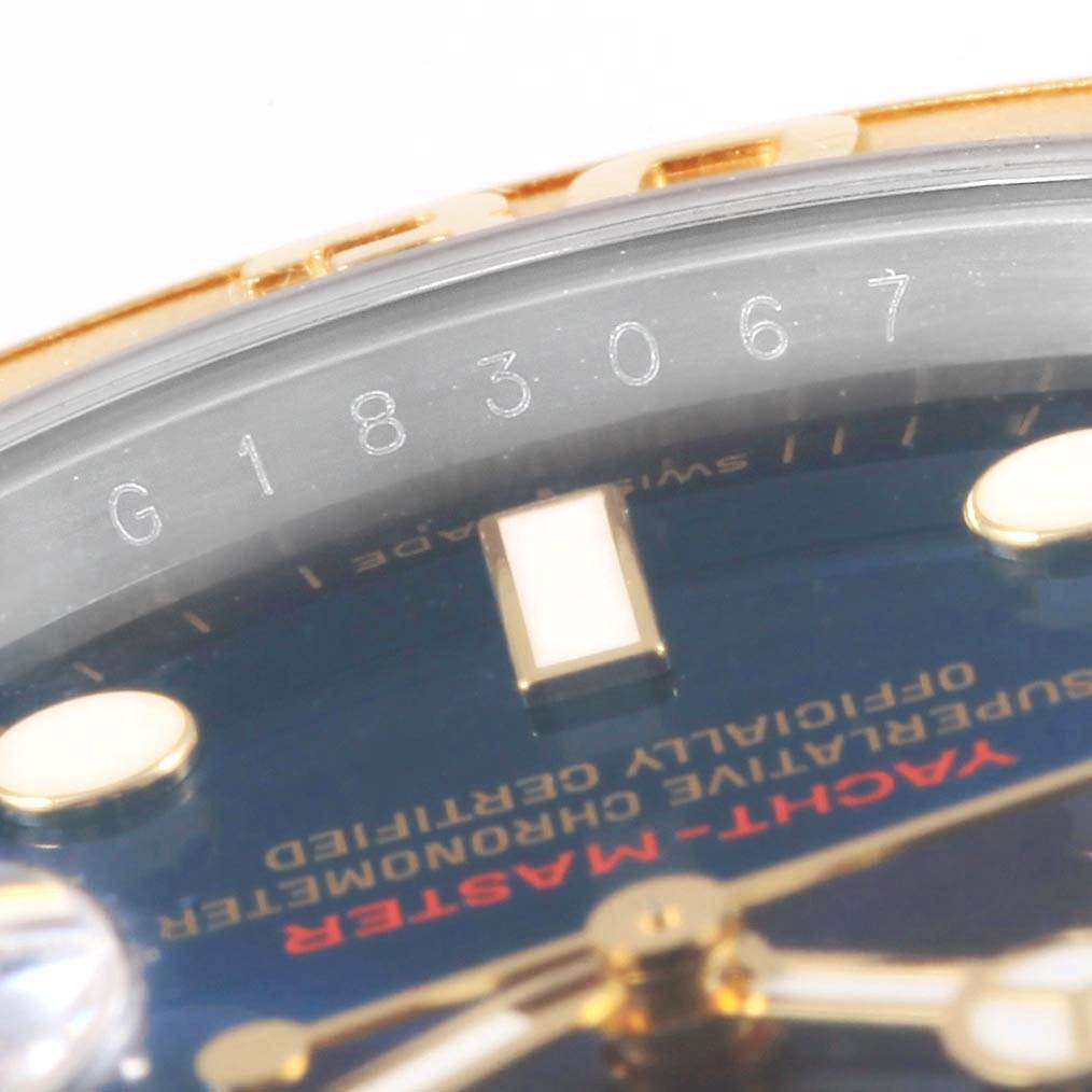This image shows a close-up of the Rolex Yacht-Master 16623 Men's Stainless Steel Blue Dial 16623 Men's Stainless Steel Blue Dial watch, emphasizing the serial number, part of the dial, and hands.