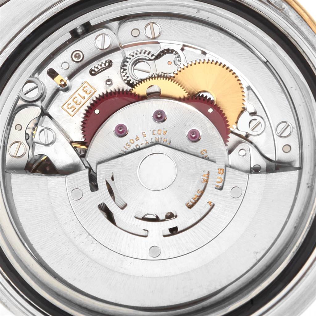 This image shows an internal view of the Rolex Yacht-Master 16623 Men's Stainless Steel Blue Dial 16623 Men's Stainless Steel Blue Dial watch, highlighting its intricate movement mechanism parts.