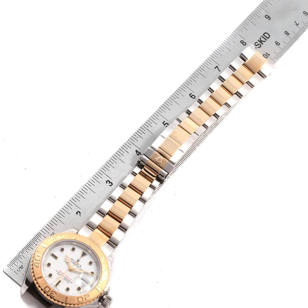 The Rolex Yacht-Master 16623 Men
s Stainless Steel White Dial 16623 Men
s Stainless Steel White Dial watch is shown from a top-down angle, featuring the face, bezel, and part of the bracelet, measured with a ruler.