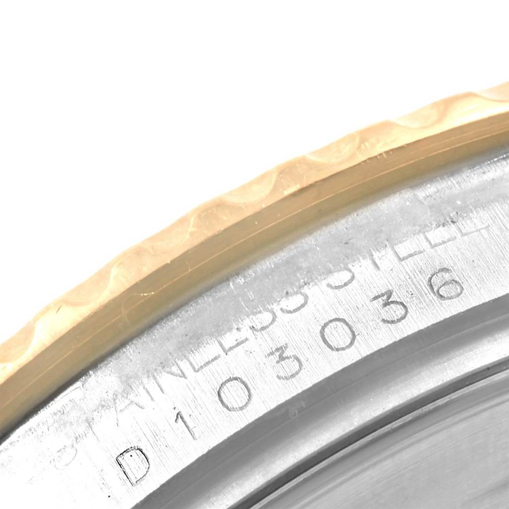 This close-up image shows the bezel and part of the case back of a Rolex Yacht-Master 16623 Men
s Stainless Steel White Dial 16623 Men
s Stainless Steel White Dial watch, highlighting the serial number and stainless steel inscription.