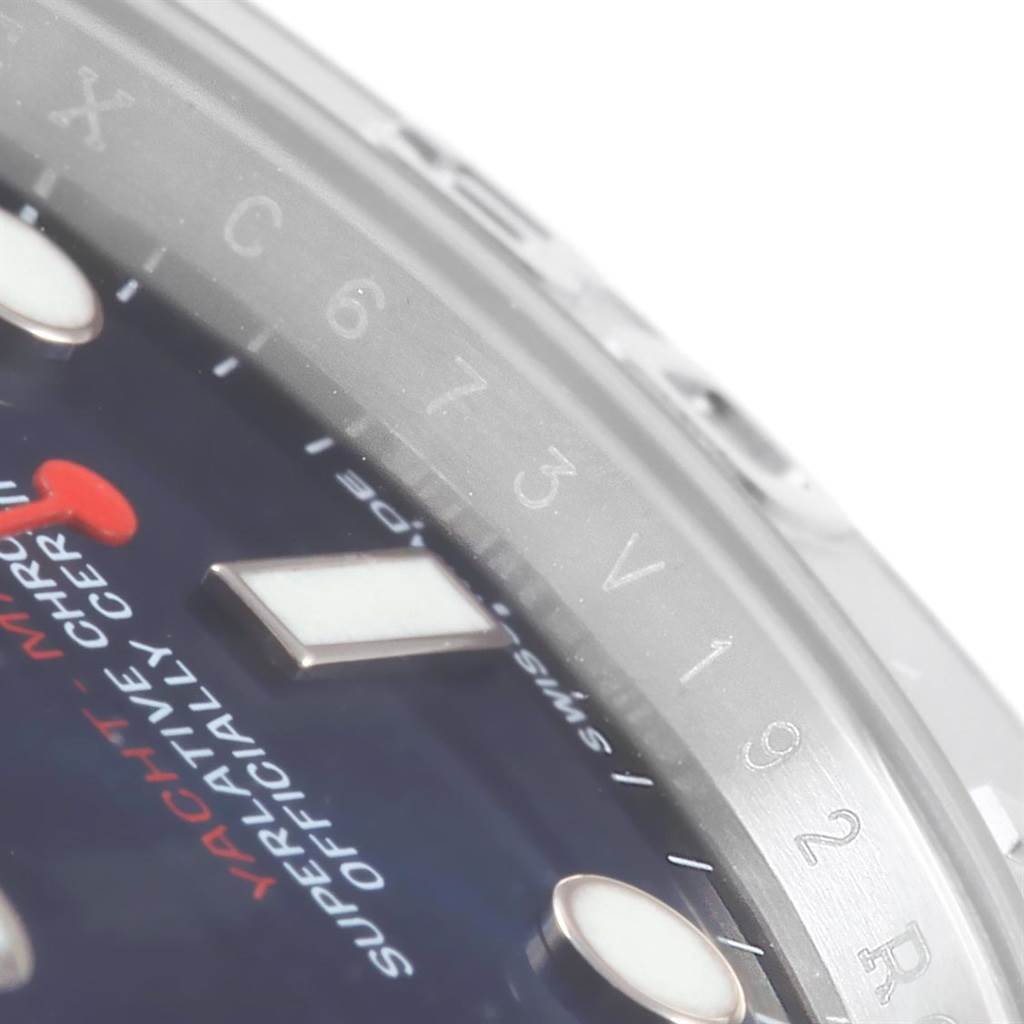 Close-up of the Rolex Yacht-Master 116622 Men's Stainless Steel Blue Dial 116622 Men's Stainless Steel Blue Dial watch displaying part of the dial, bezel, and some markings.