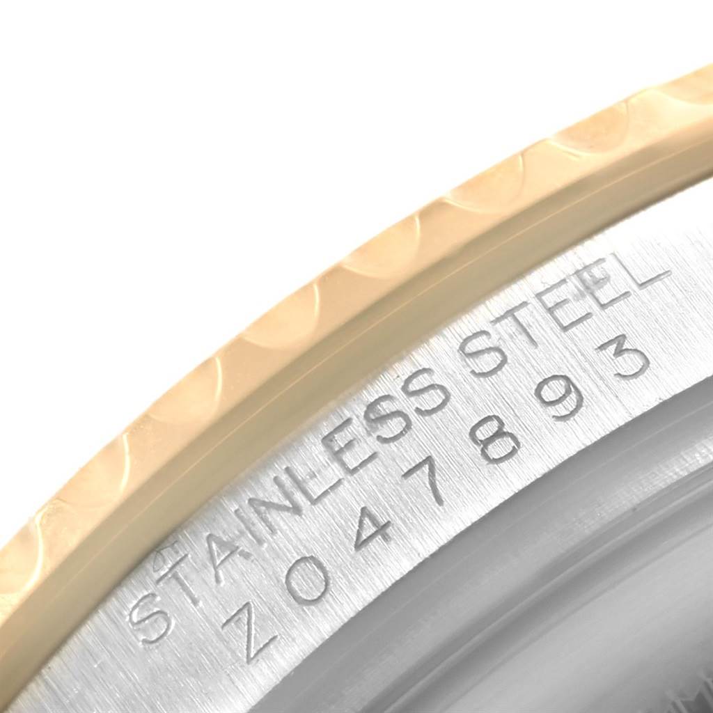 This close-up image of the Yacht-Master model by Rolex shows a partial view of the bezel and the engraved serial number.