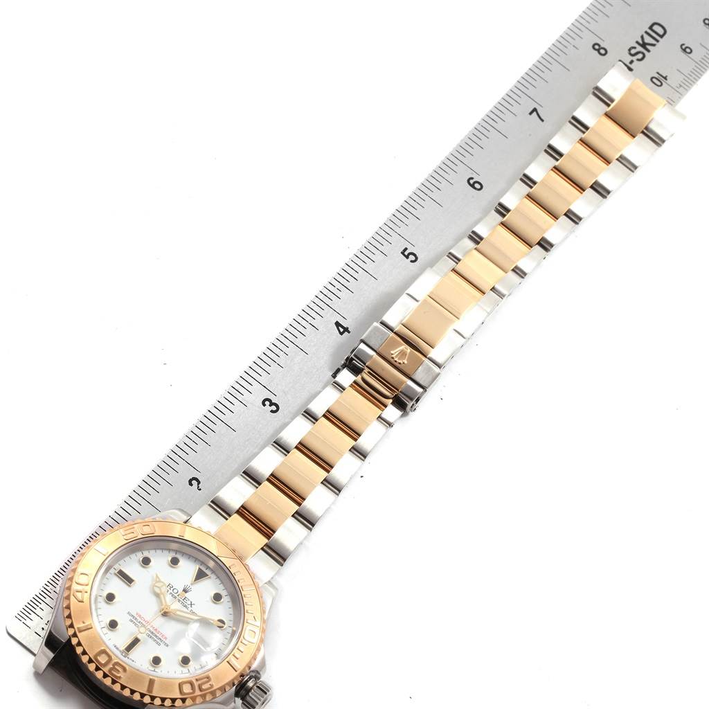 The image shows a Rolex Yacht-Master 16623 Men's Stainless Steel White Dial 16623 Men's Stainless Steel White Dial watch, including its face, bezel, and bracelet, positioned next to a ruler for scale.