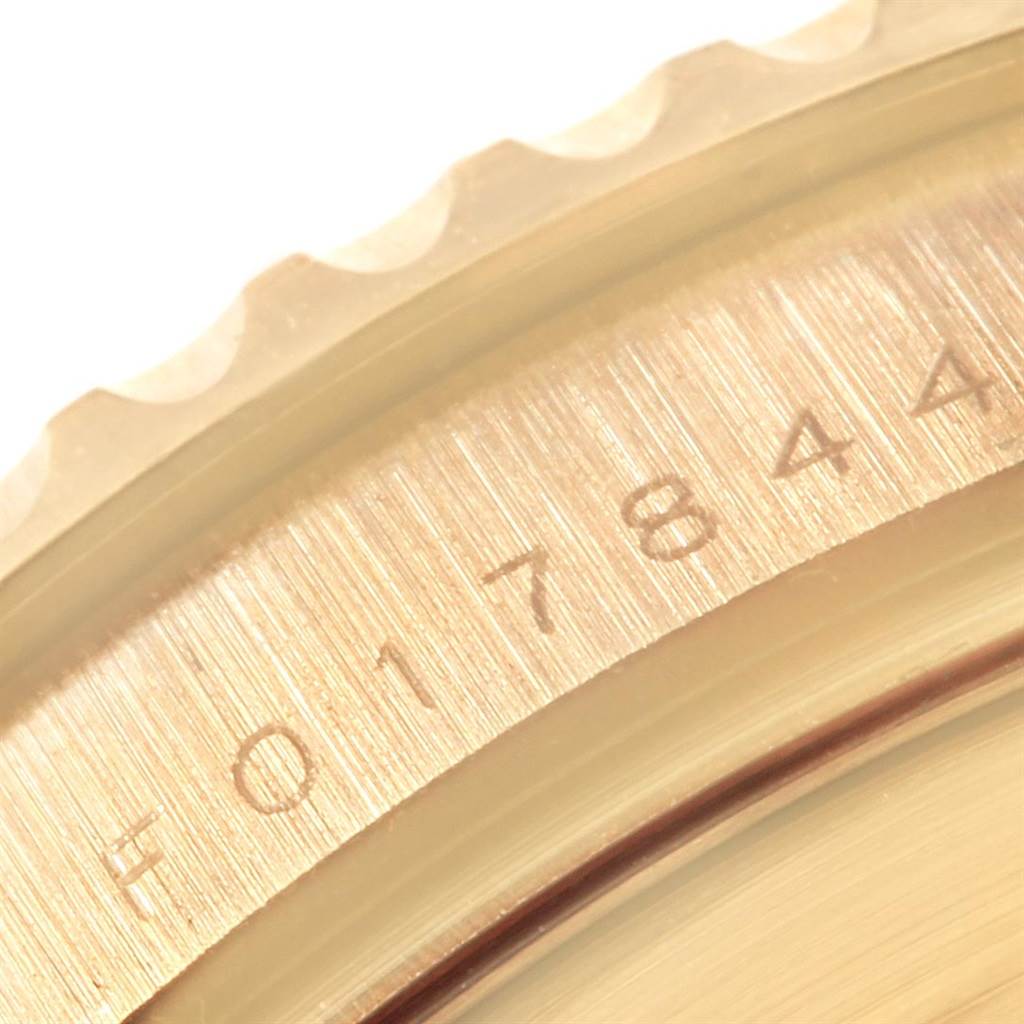 This close-up angle shows the engraved serial number on the bezel of a Rolex Yacht-Master 16628 Men's Yellow Gold Mother of Pearl Dial 16628 Men's Yellow Gold Mother of Pearl Dial watch.