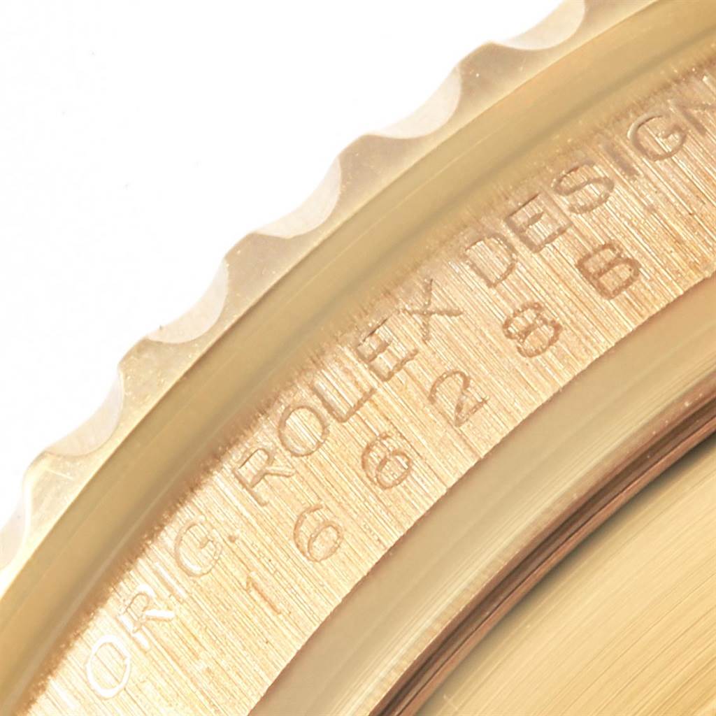 This image shows a close-up of the bezel and engraved inner ring of a Rolex Yacht-Master 16628 Men's Yellow Gold Mother of Pearl Dial 16628 Men's Yellow Gold Mother of Pearl Dial watch.
