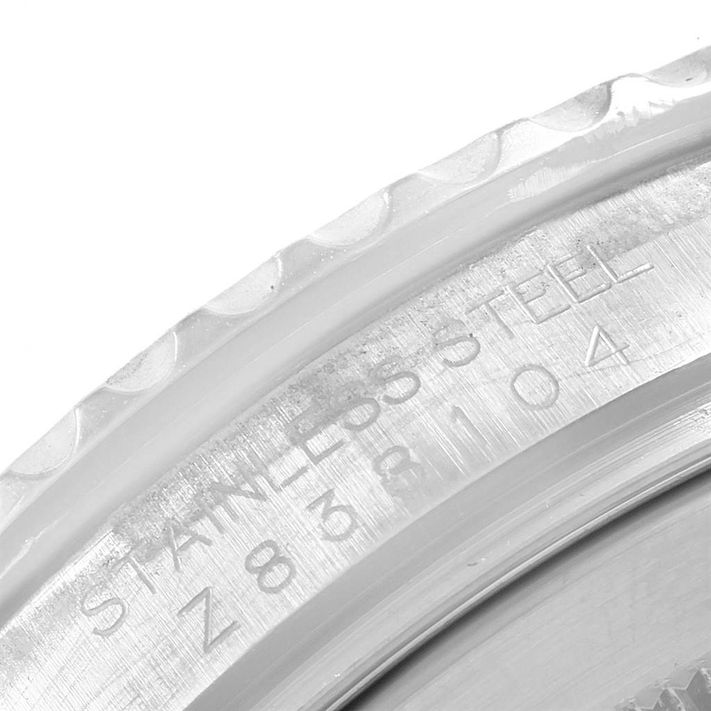 The image shows a close-up angle of the bezel and engraved stainless steel details of a Rolex Yacht-Master 16622 Men's Stainless Steel Silver Dial 16622 Men's Stainless Steel Silver Dial watch.