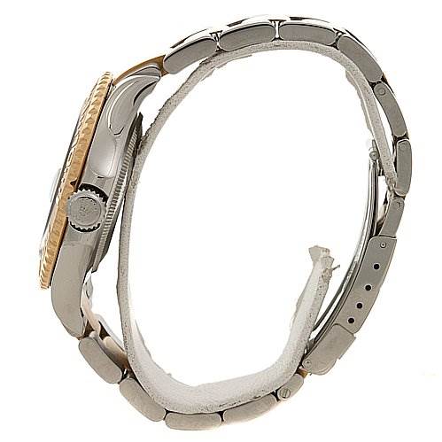 The image shows a side view of a Cartier Tank Française watch, focusing on the case, crown, and bracelet links.