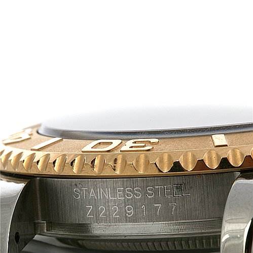 The image shows a close-up of the bezel and the stainless steel casing with an engraved serial number of a Cartier Tank Francaise 16623 Women's Steel and Gold (two tone) Champagne Dial 16623 Women's Steel and Gold (two tone) Champagne Dial watch.