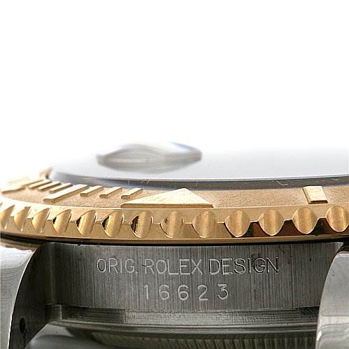 This image does not show the Cartier Tank Francaise 16623 Women's Steel and Gold (two tone) Champagne Dial 16623 Women's Steel and Gold (two tone) Champagne Dial model; it is a close-up of a Rolex watch case and bezel, displaying the model number 16623.