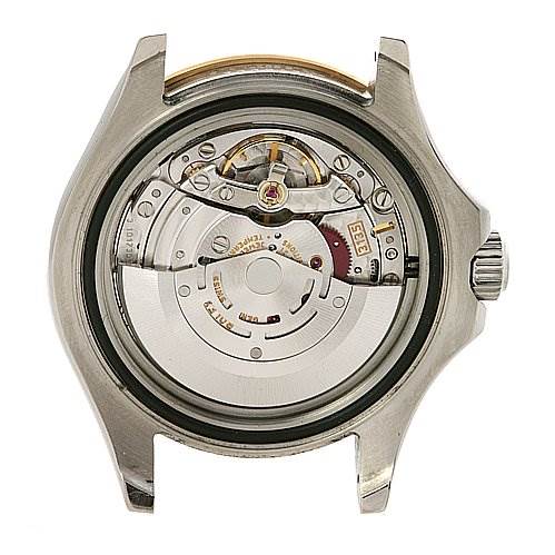 The image shows the back view of the Cartier Tank Française watch case exposing its intricate movement.