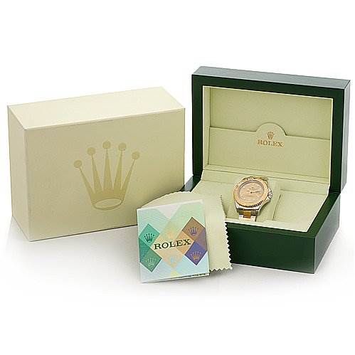 This is a product image of a Rolex watch in its open box, featuring the watch, its interior, exterior packaging, and a cleaning cloth.