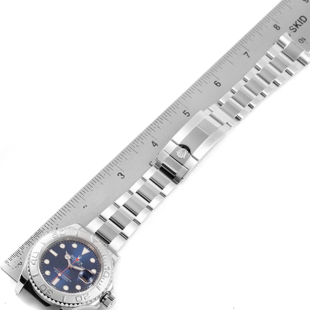 The image shows a side view of a Rolex Yacht-Master 116622 Men's Stainless Steel Blue Dial 116622 Men's Stainless Steel Blue Dial watch laid flat with a ruler next to it for scale.
