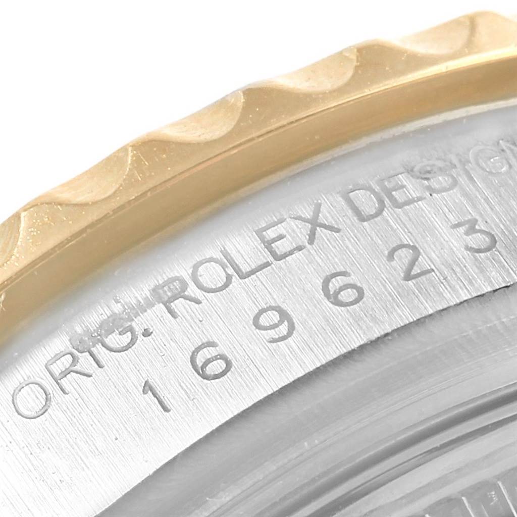The image shows a close-up of the serial number and bezel of a Rolex Yacht-Master 169623 Women's Steel and Gold (two tone) White Dial 169623 Women's Steel and Gold (two tone) White Dial watch.