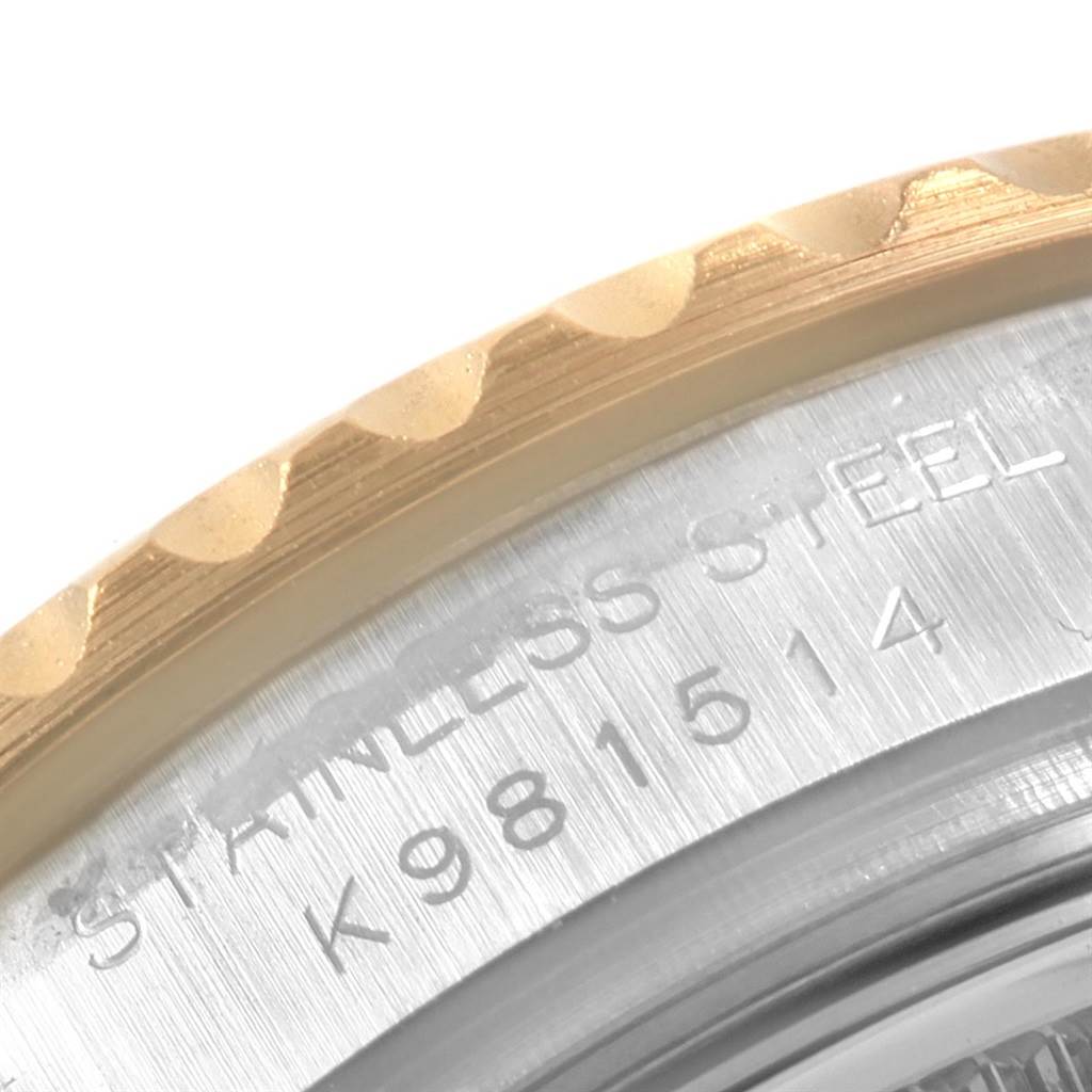 The image shows a close-up of the bezel and case back of a Rolex Yacht-Master 169623 Women's Steel and Gold (two tone) White Dial 169623 Women's Steel and Gold (two tone) White Dial watch, highlighting part of the serial number and text.
