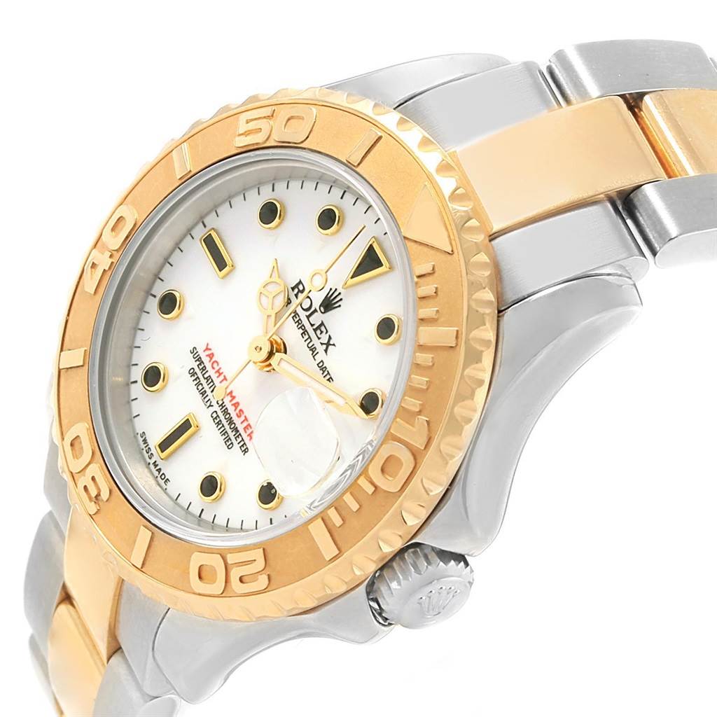 The image shows a close-up of a Rolex Yacht-Master 169623 Women's Steel and Gold (two tone) White Dial 169623 Women's Steel and Gold (two tone) White Dial watch, focusing on the face, bezel, and part of the bracelet at an angled view.