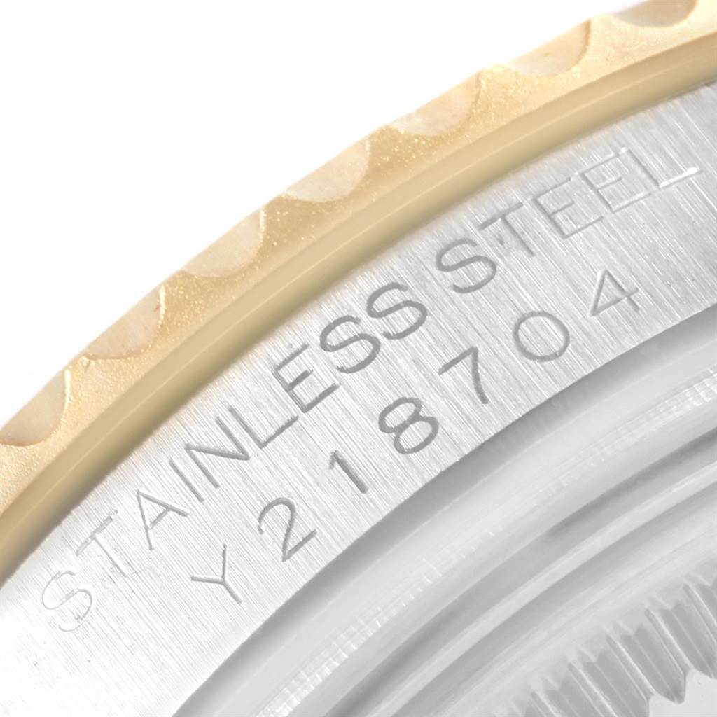 This close-up image shows the bezel and engraved serial number on a Rolex Yacht-Master 168623 Men's Steel and Gold (two tone) White Dial 168623 Men's Steel and Gold (two tone) White Dial watch.