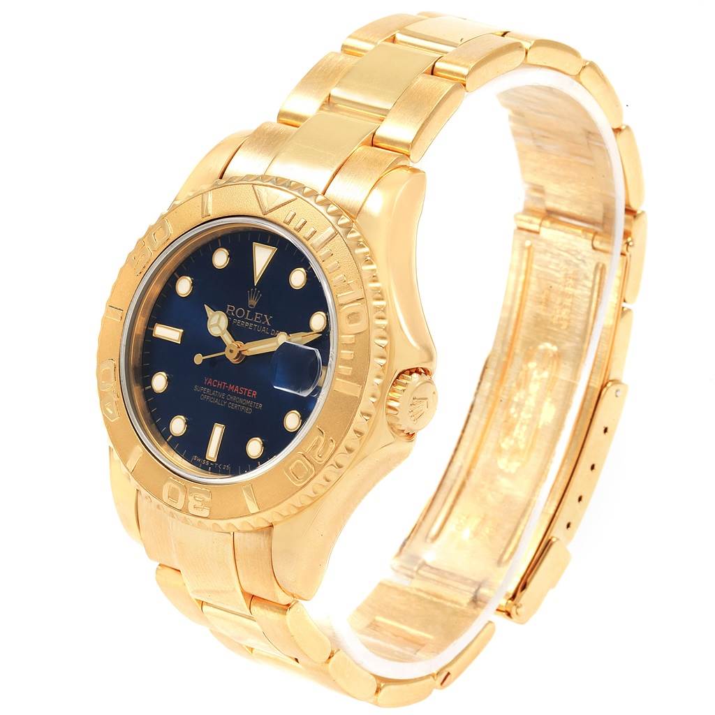 This image shows a Rolex Yacht-Master 68628 Yellow Gold Blue Dial 68628 Yellow Gold Blue Dial watch at an angle revealing the face, bezel, and bracelet.