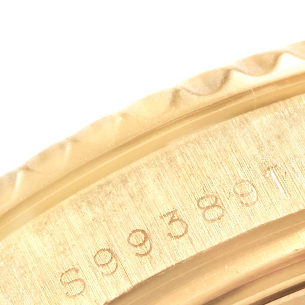 This image shows a close-up angle of the bezel and a portion of the case with serial numbers of the Rolex Yacht-Master 68628 Yellow Gold Blue Dial 68628 Yellow Gold Blue Dial watch.