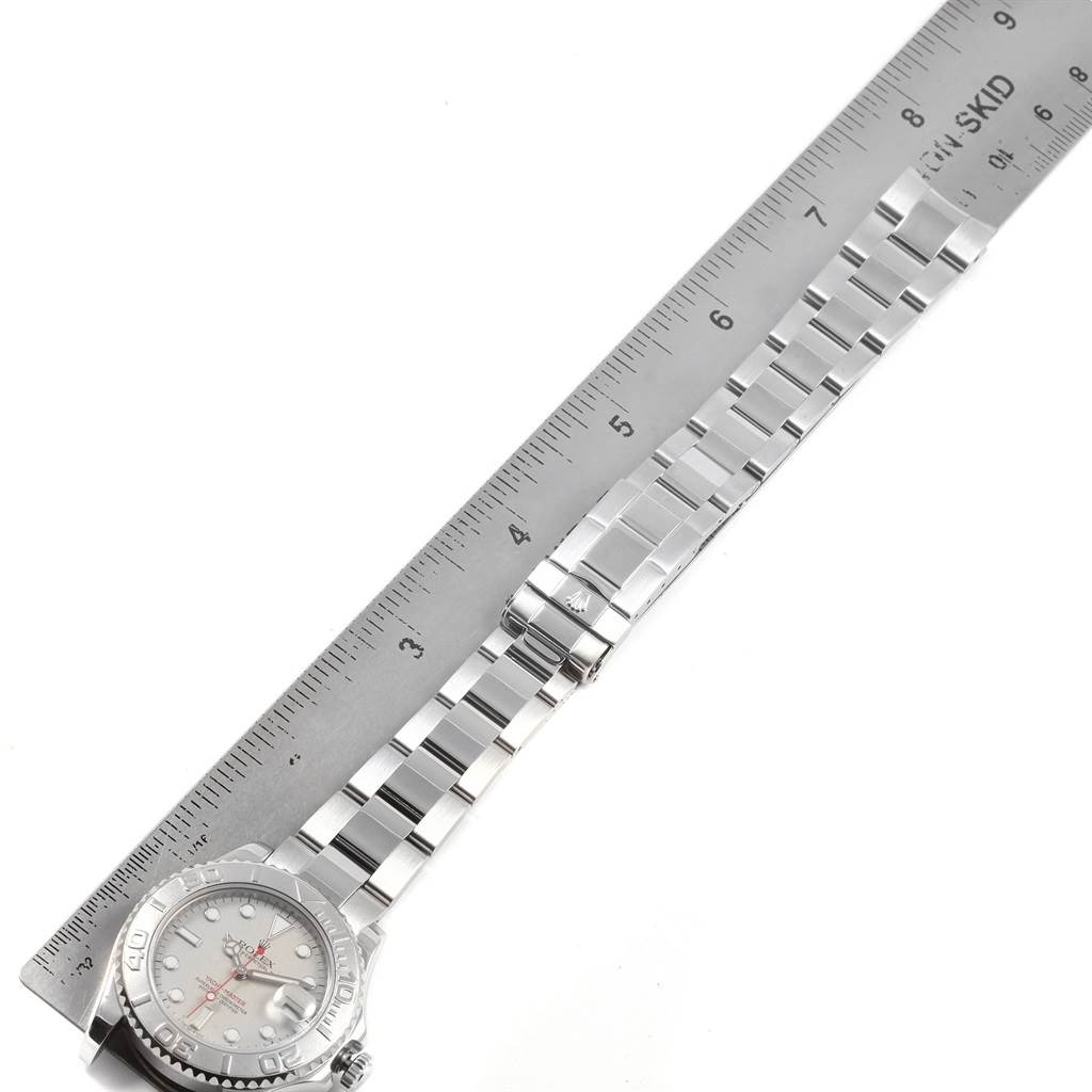 The image shows a Rolex Yacht-Master 168622 Men's Stainless Steel Silver Dial 168622 Men's Stainless Steel Silver Dial model watch lying flat beside a ruler, displaying the watch face and band.