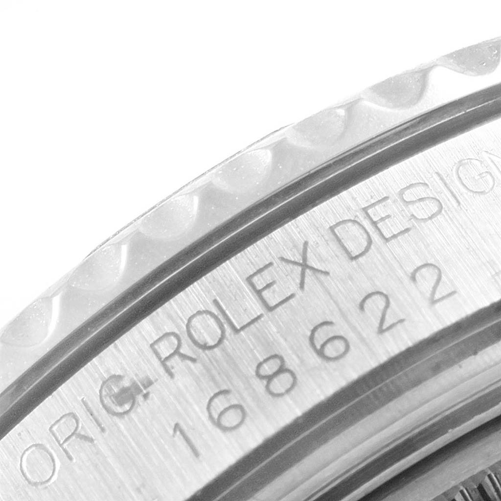 A close-up angle showing the engraved side of the Rolex Yacht-Master 168622 Men's Stainless Steel Silver Dial 168622 Men's Stainless Steel Silver Dial watch bezel and case.