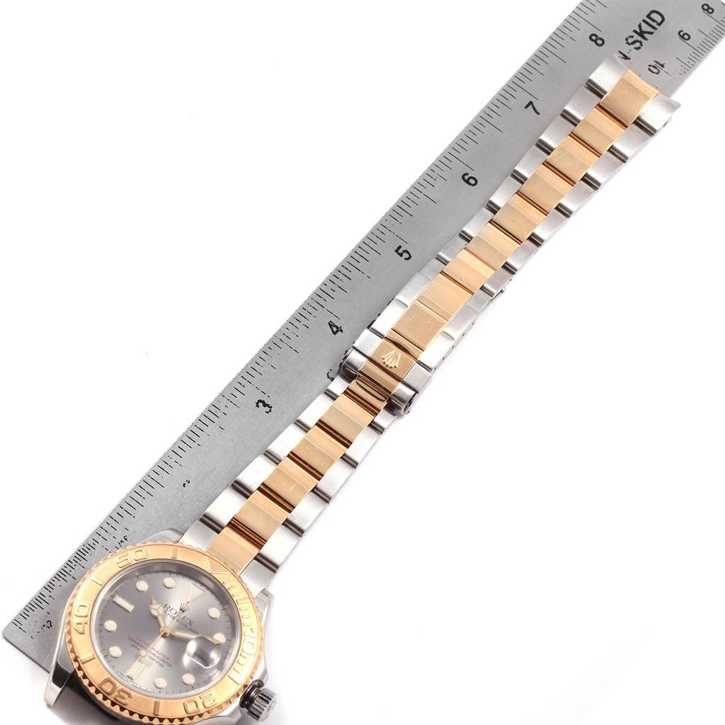 The image shows a Rolex Yacht-Master 16623 Men's Stainless Steel Grey Dial 16623 Men's Stainless Steel Grey Dial watch laid flat with a focus on the band and clasp, alongside a ruler.
