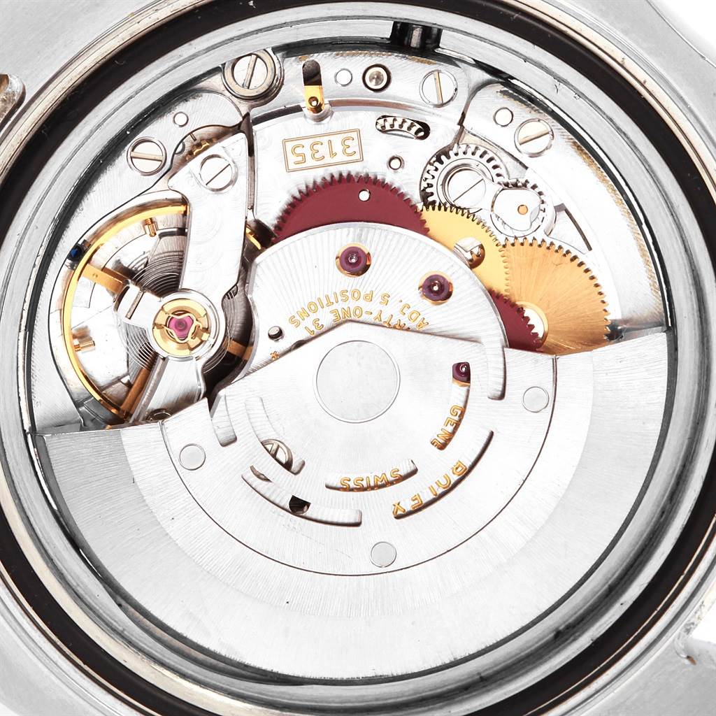 The image shows a close-up view of the internal mechanism of a Rolex Yacht-Master 16623 Men's Stainless Steel Grey Dial 16623 Men's Stainless Steel Grey Dial watch, highlighting gears and other mechanical parts.