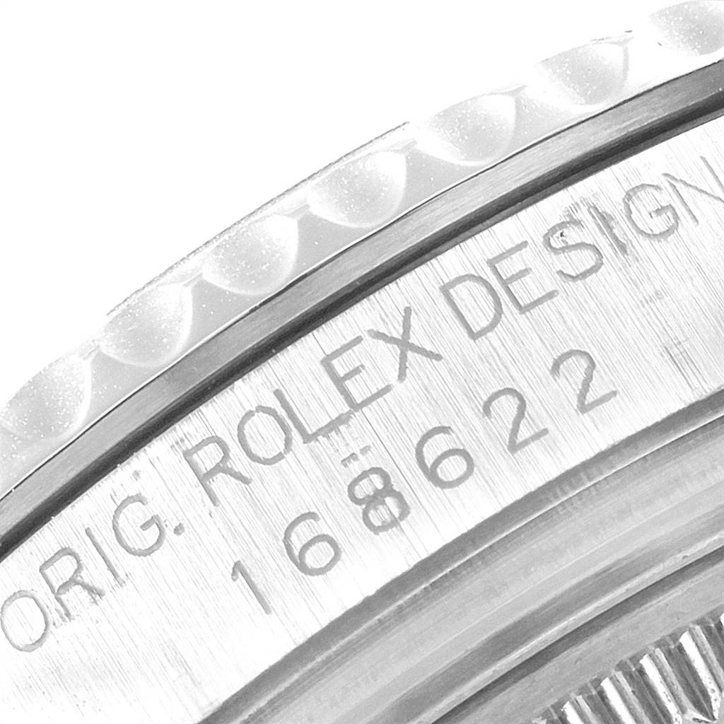 This close-up image shows the engraved bezel and part of the case of the Rolex Yacht-Master 168622 Men
s Stainless Steel Silver Dial 168622 Men
s Stainless Steel Silver Dial watch.
