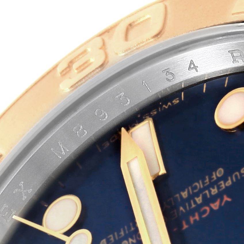 This close-up image shows the bezel, part of the face, and the hour hand of the Rolex Yacht-Master 16623 Men's Stainless Steel Blue Dial 16623 Men's Stainless Steel Blue Dial watch.