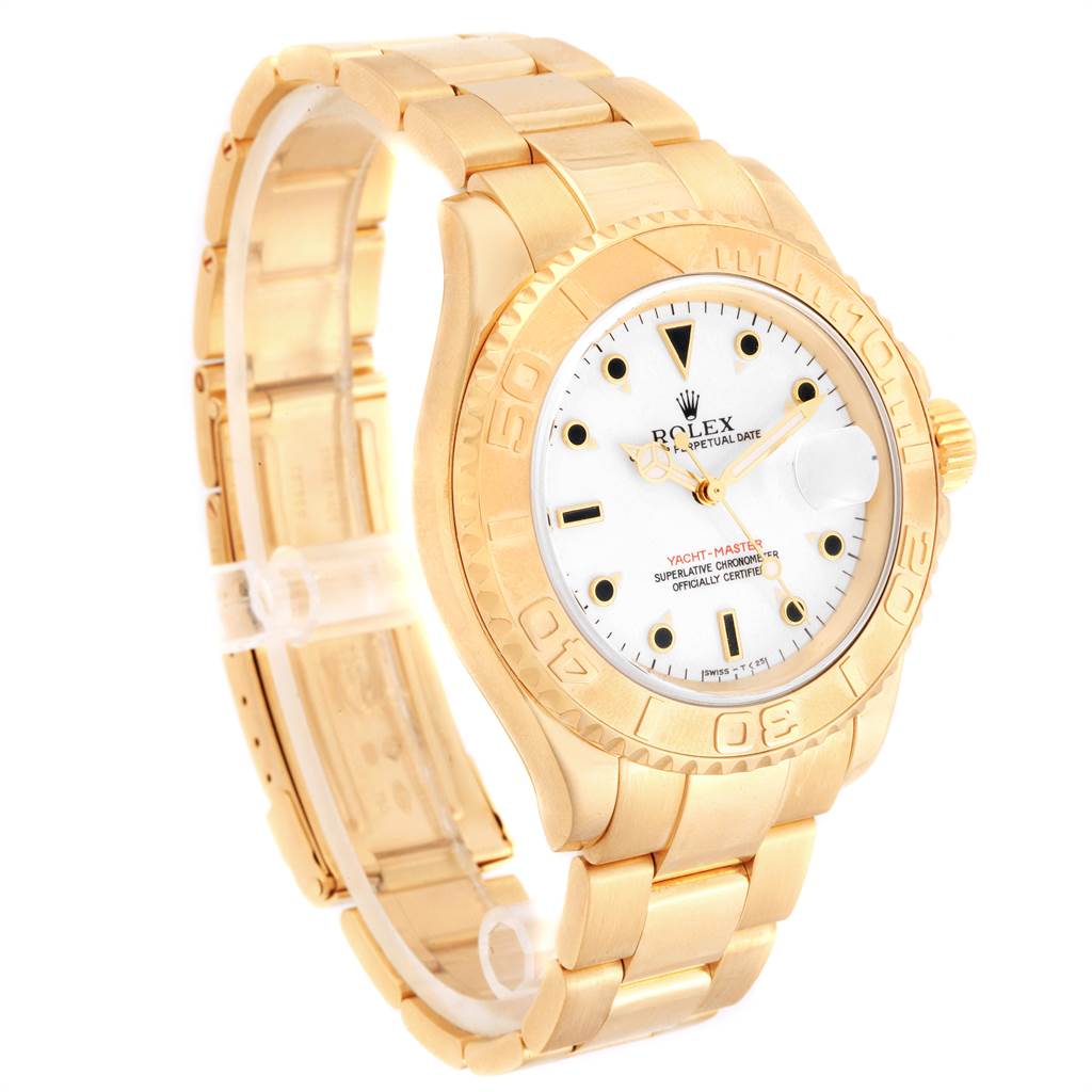 The image shows a side angle of the Rolex Yacht-Master 16628 Men's Yellow Gold White Dial 16628 Men's Yellow Gold White Dial showcasing the dial, bezel, and part of the bracelet.